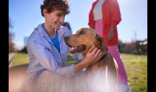 Young people in park with dog