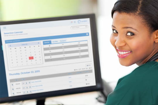 Veterinarian viewing her client appointment calendar